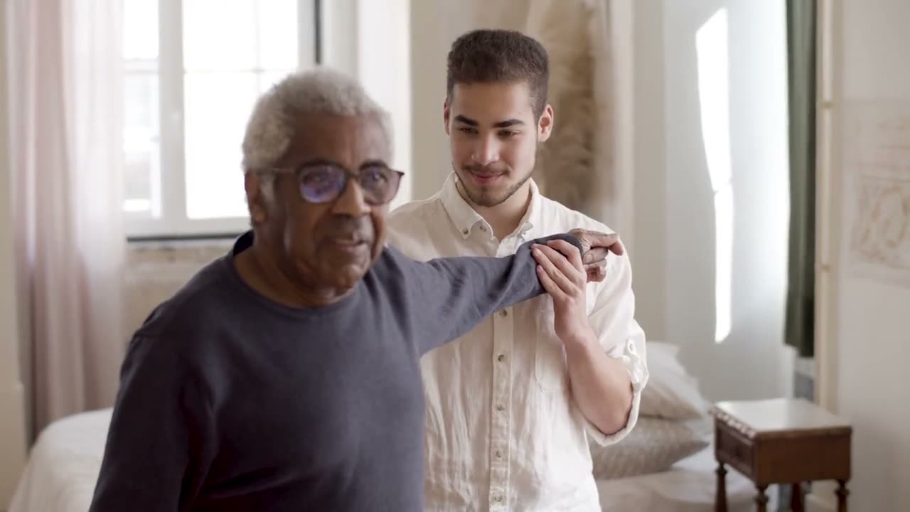 Care professional talking with an older person at home